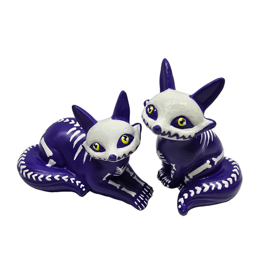 purple fox figures with white skeleton design