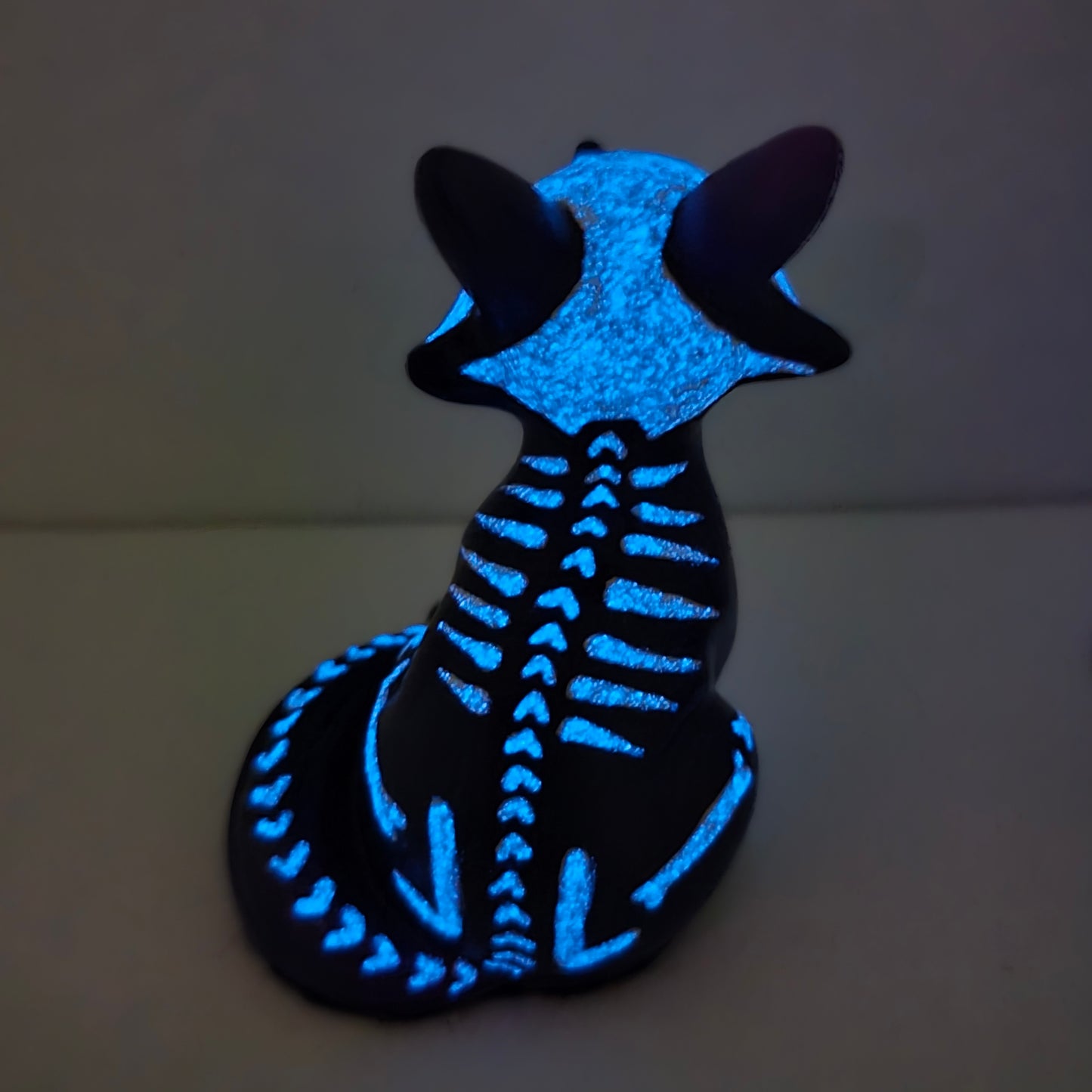 the back of fox kit figure, skeleton design glowing in the dark (cute halloween figure) 