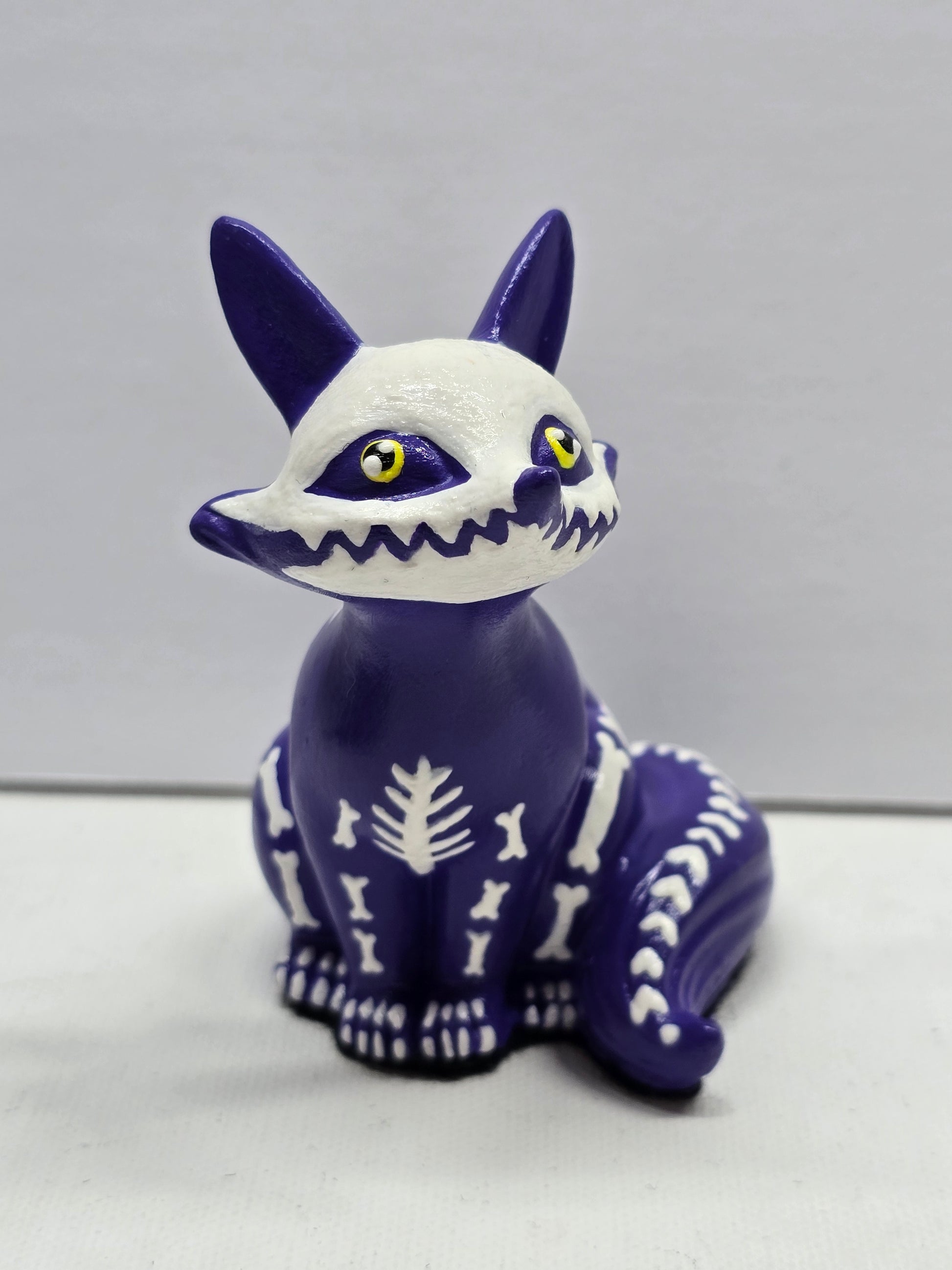 Cute halloween figure of a fox skeleton with yellow eyes