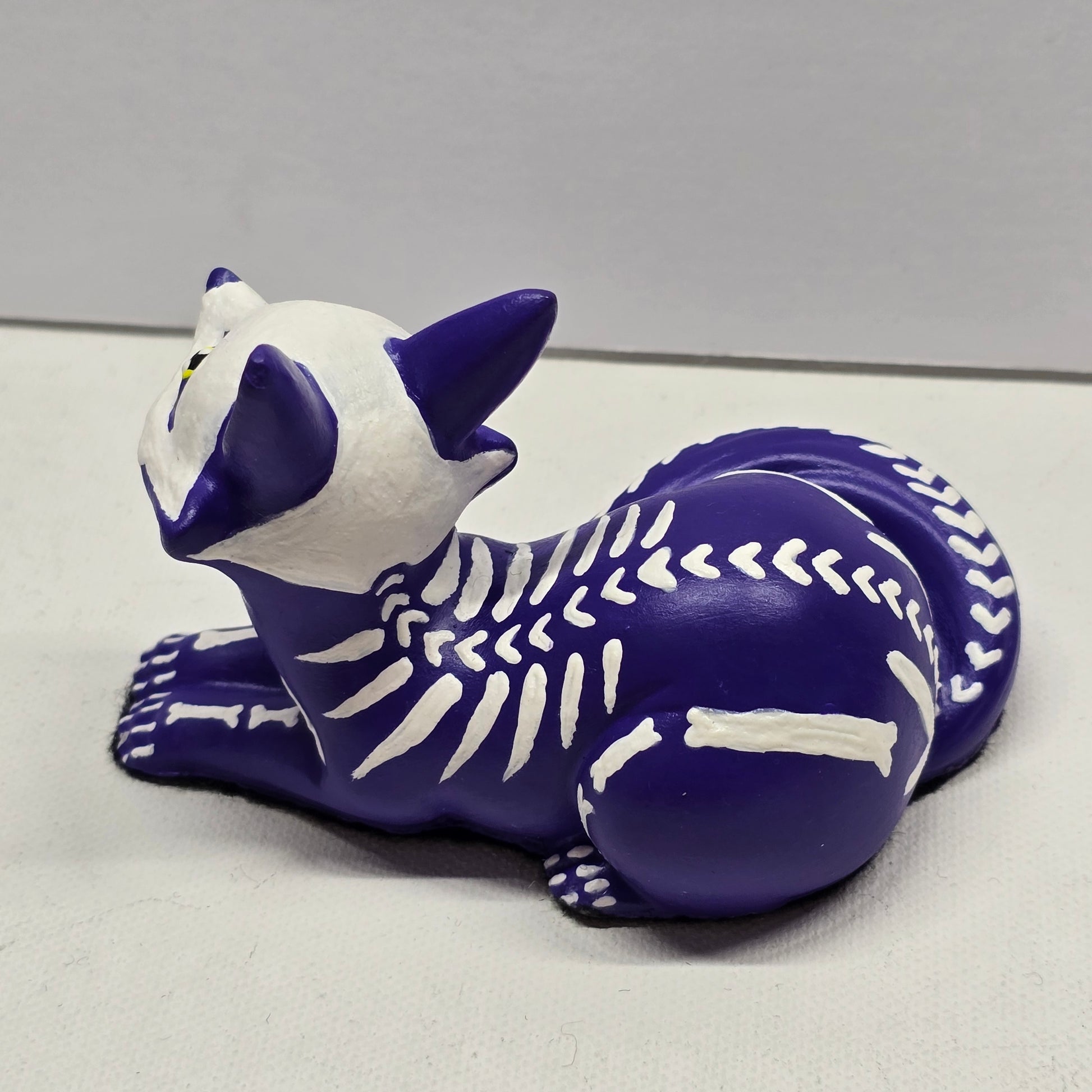 Purple fox kit figure with skeleton design and heart shaped spine bones