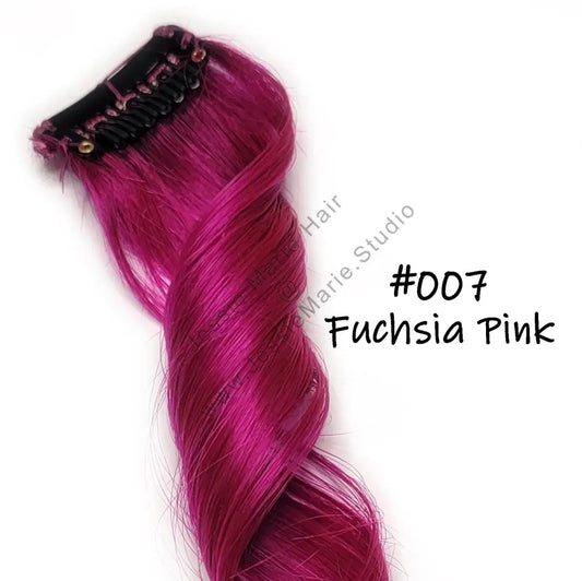 Fuchsia clip in human hair extensions