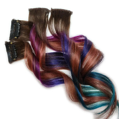 Hair colored pink, purple, aqua blue with rose gold highlights 